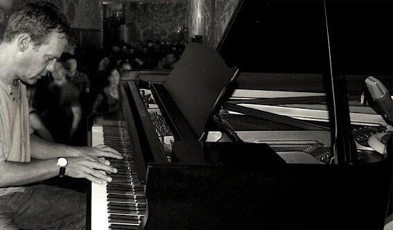 Nigel Goulding playing a grand piano